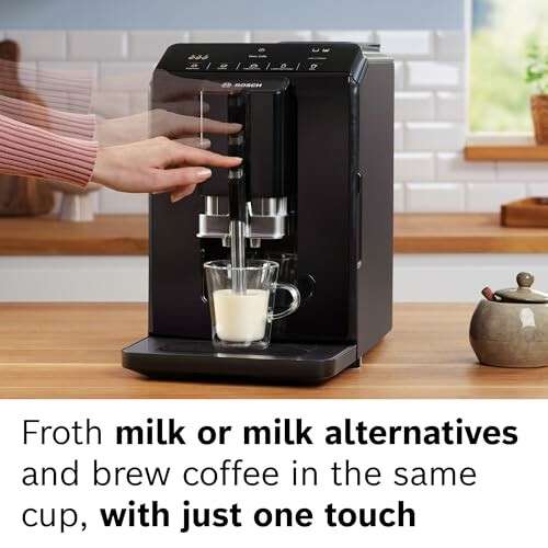 Coffee machine frothing milk with one touch operation