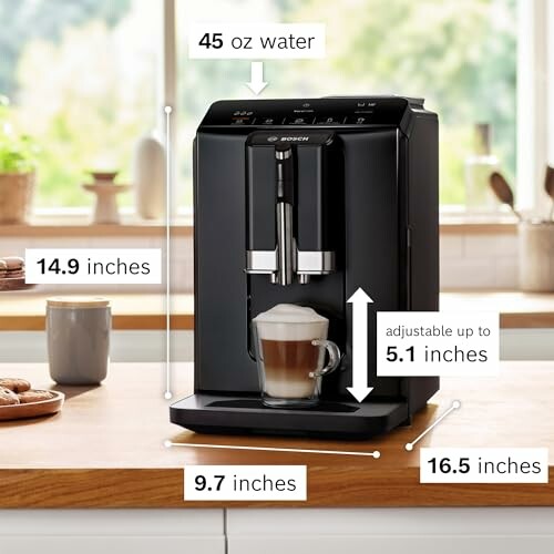 Compact black coffee machine on countertop with dimensions labeled.