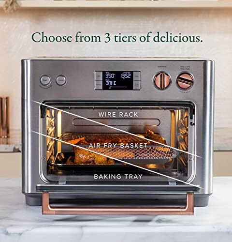 Kitchen appliance with wire rack, air fry basket, and baking tray.