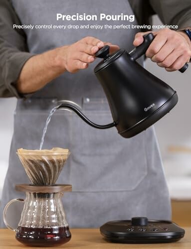 Person pouring water into a pour-over coffee maker