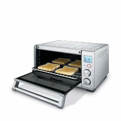 Stainless steel toaster oven with toast inside