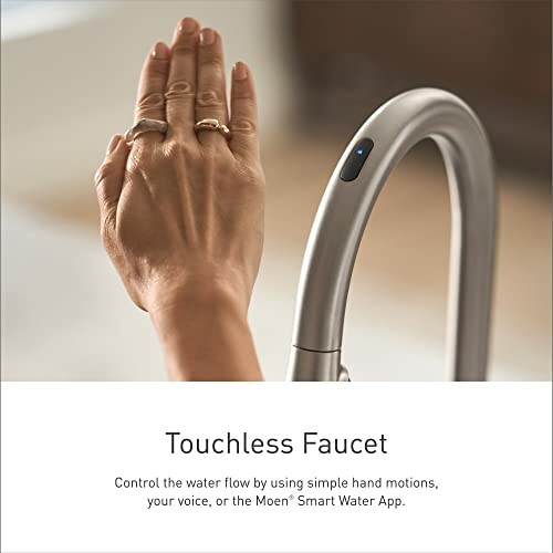 Hand using touchless faucet with motion sensor.